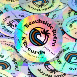Beachside Retro Records holographic stickers for a vinyl record shop. Text reads. Beachside Rettro & Records. Satellite. Beach, FLA. www.beachsideretro.com