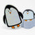 Holographic glitter penguin stickers on a white background